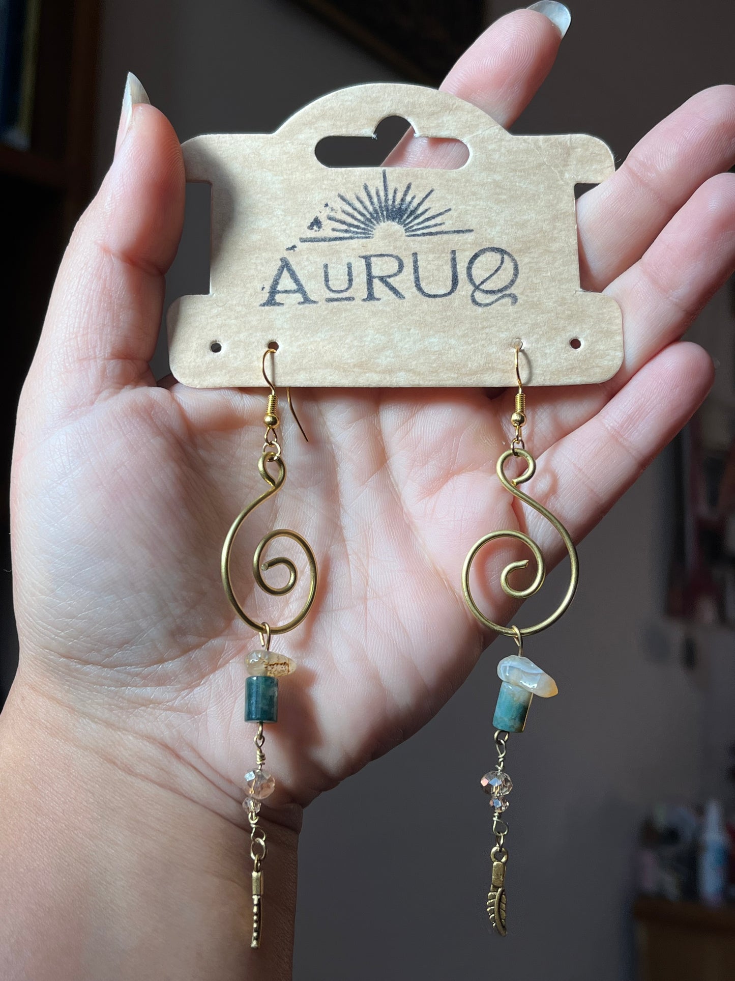 Long Soliman’s stones earrings.