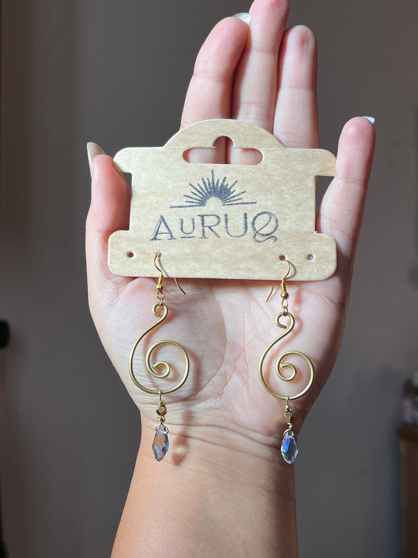 Crystal spiral earrings .