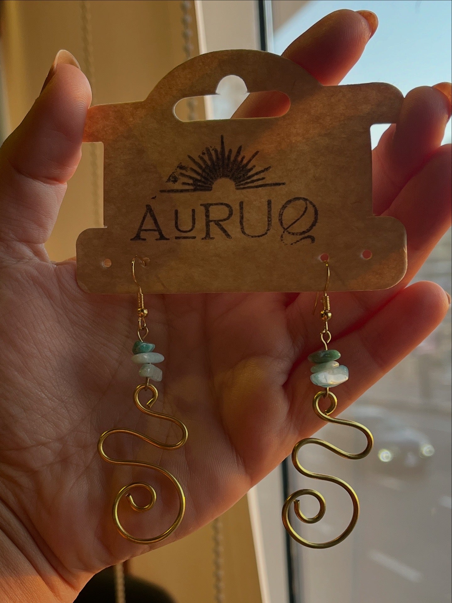 Blue spiral gemstones paired earrings.