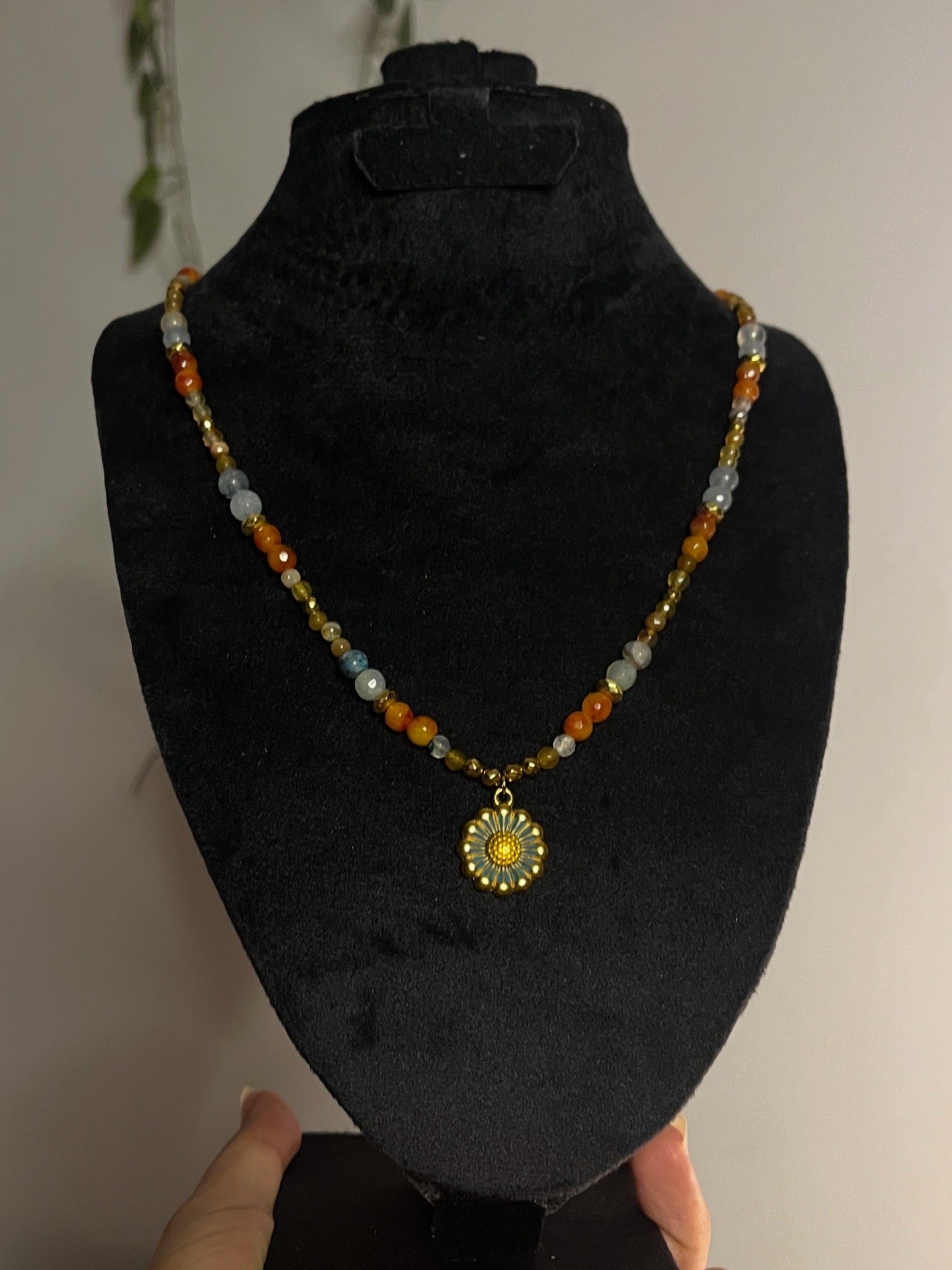 Daisy warm colored necklace.