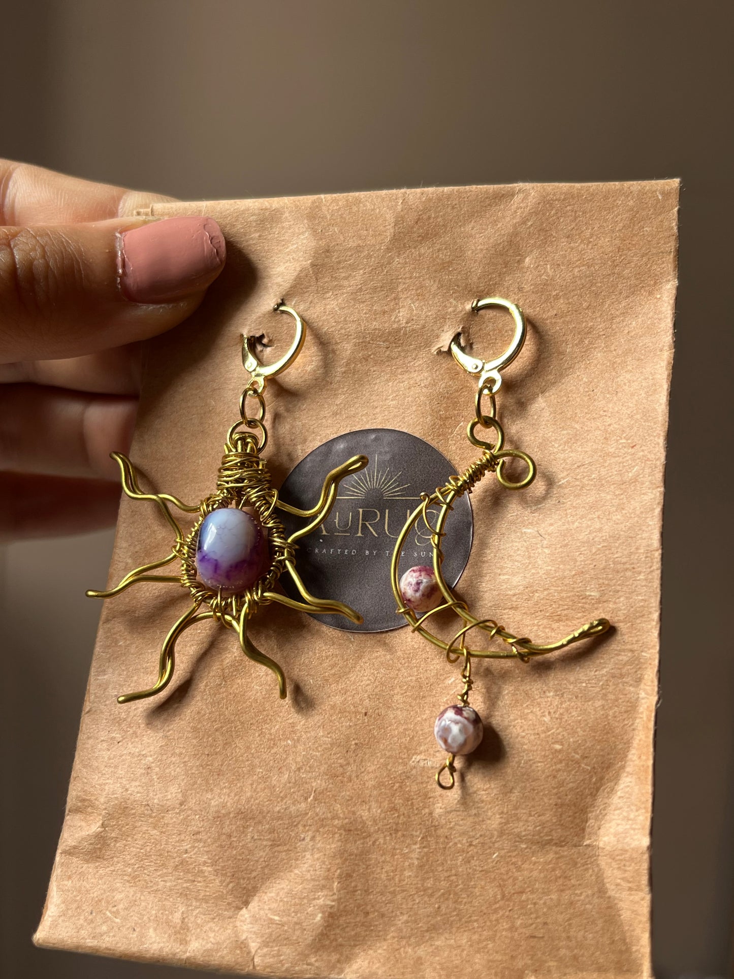 Sun and moon paired earrings.