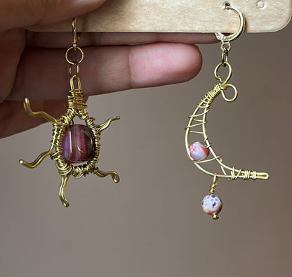 Sun and moon paired earrings.