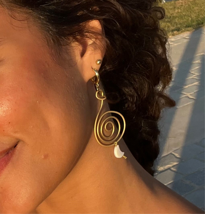 Non-identical spiral paired earrings.
