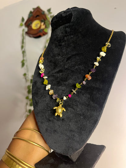 Colorful gemstones turtle necklace .