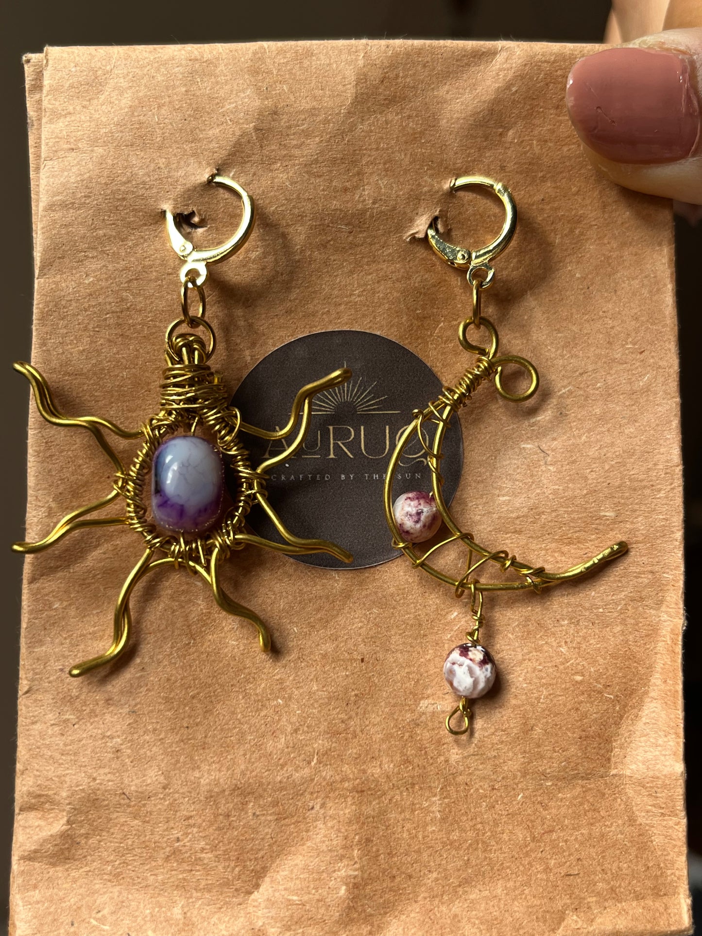 Sun and moon paired earrings.