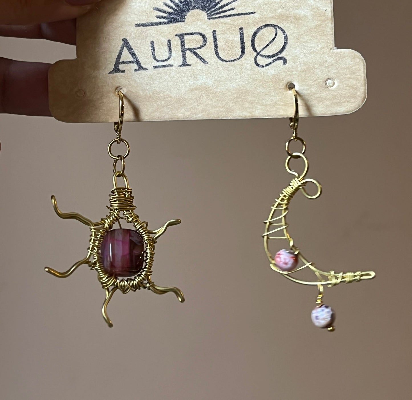 Sun and moon paired earrings.