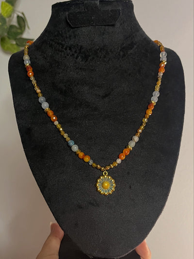Daisy warm colored necklace.