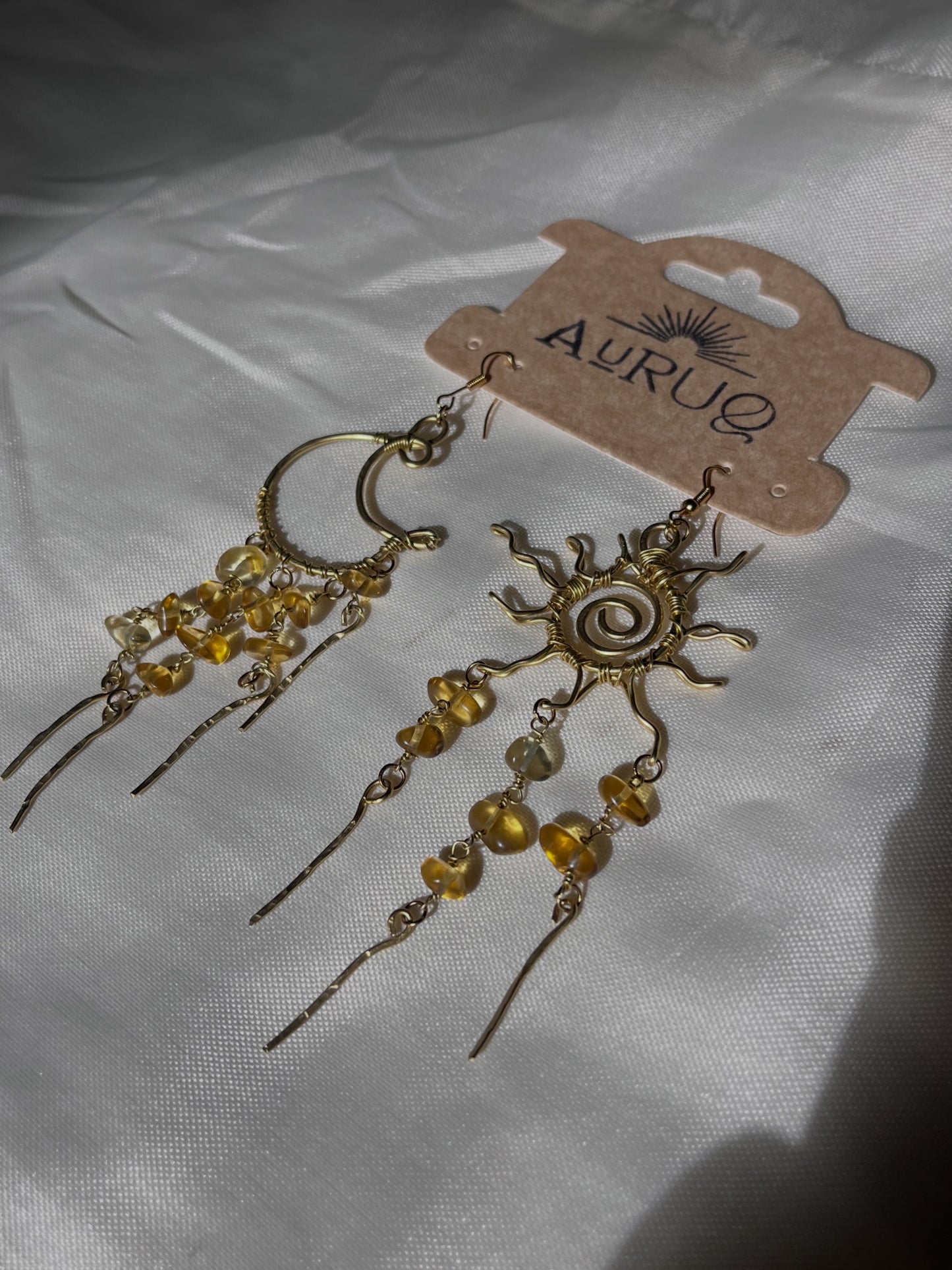 Chandelier sun and moon earrings.