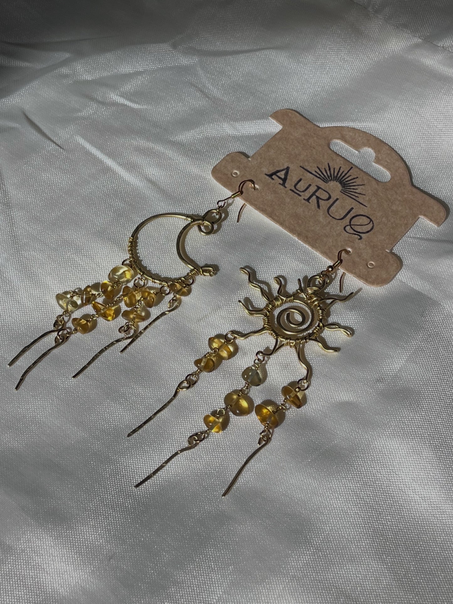 Chandelier sun and moon earrings.