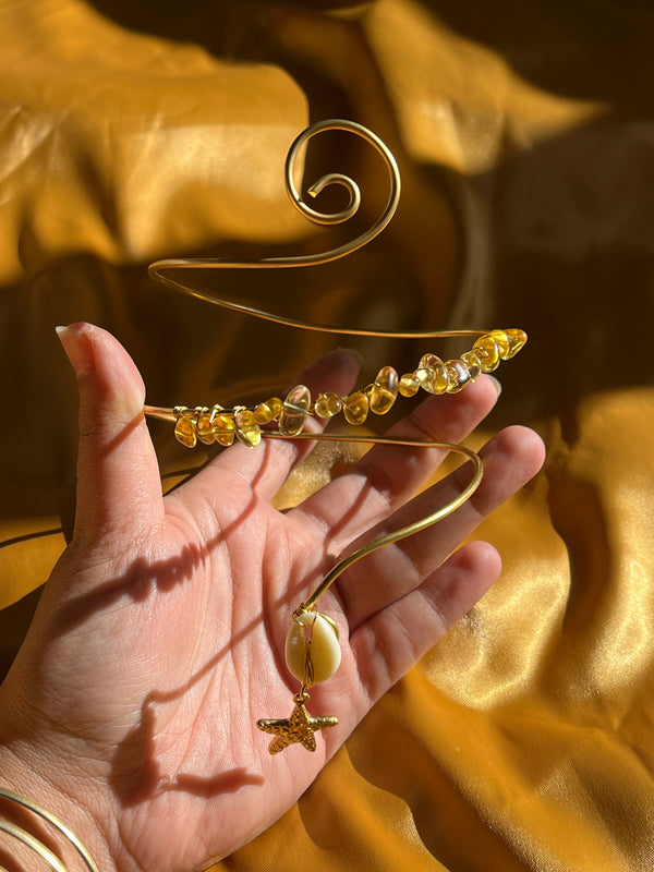 Yellow Shelly Arm cuff.