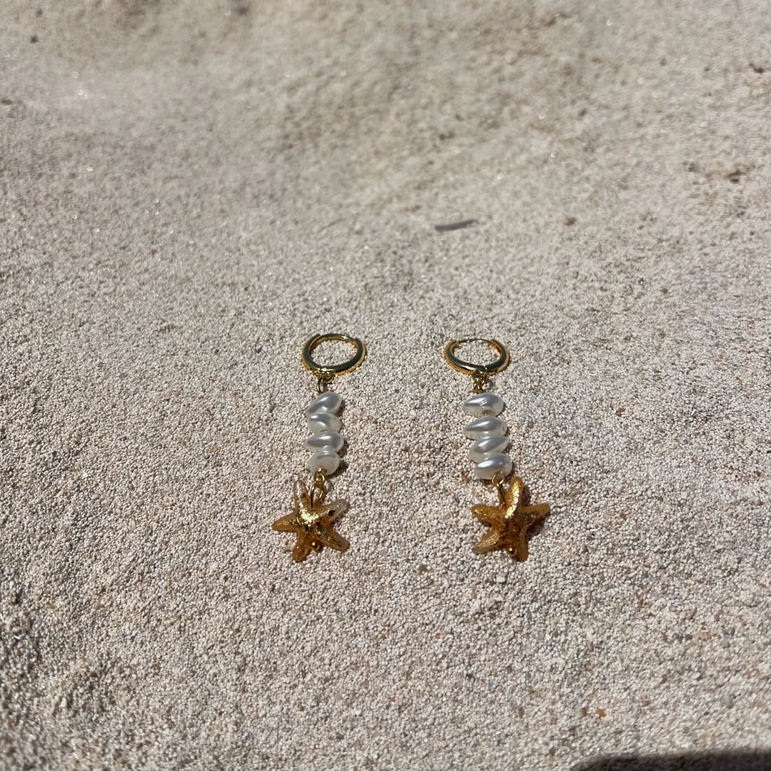 Golden Starfish paired earrings.